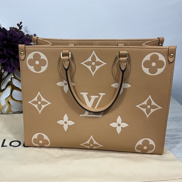Louis Vuitton Handbags - Sold Louis Vuitton OntheGo Mm Biicolor Arizona Beige